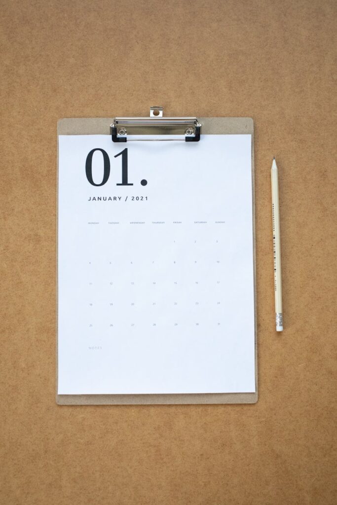 a calendar page on a clipboard