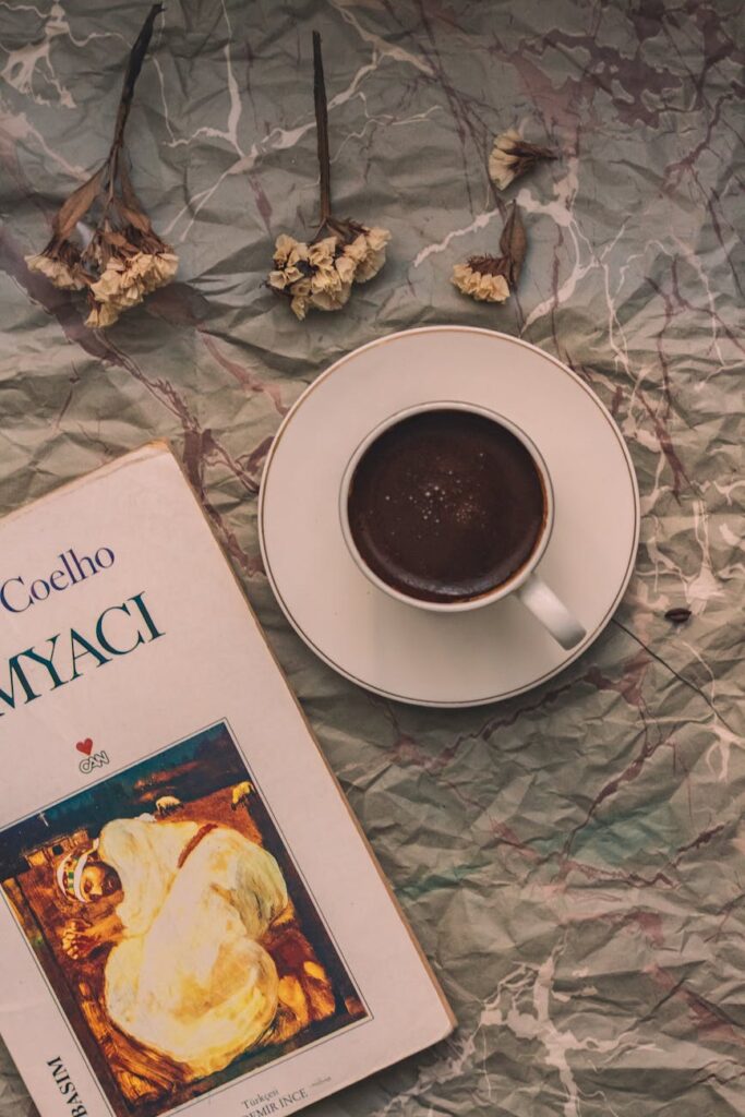 cozy setting with coffee and book on rustic background